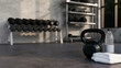 © bongkarn - Sport equipments, Kettlebell, towels, bottle water and empty space on gym floor
