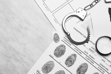 Sticker - Paper sheets with finger prints and handcuffs on white background