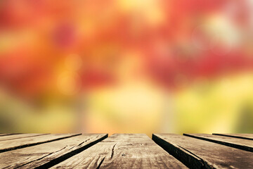 Poster - Wooden table with autumn leaves background, Multicolored leafs in sunny fall afternoon.