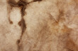 © pla - Old fabric with brown stains full frame for background, murder case idea, old blood stains on fabric,cream brown abstract