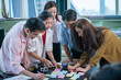 © Me studio - individual team training business office business education group asia teamwork.Conduct a seminar on a success communication strategy.Students and young female students and colleagues start a computer