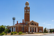 An Historic Courthouse With A Tall Clock Tower And Cupola