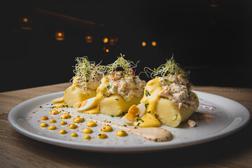 Typical Peruvian appetizer with mashed potatoes and spicy sauce.