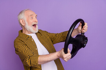 Poster - Photo portrait of funky granddad grey hair fast taxi driver dressed trendy yellow checkered shirt isolated on lilac purple color background