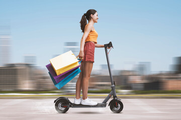 Wall Mural - Woman holding shopping bags and riding a scooter