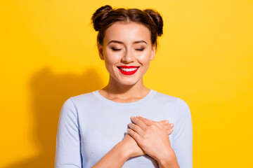 Wall Mural - photo of cute good mood young lady touch her chest hear express her gratitude isolated on yellow col
