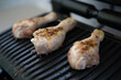 © Aleksander - Cooking chicken legs on an electric grill, on the balcony of the apartment
