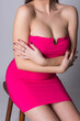 © Adam Radosavljevic - Provocative pose of young attractive sexy woman in pink dress