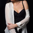 © Adam Radosavljevic - Provocative pose of young woman dresed in white shirt and black lingerie clothing