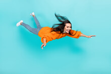 Full Length Photo Of Pretty Satisfied Person Fly Falling Toothy Smile Isolated On Teal Color Background