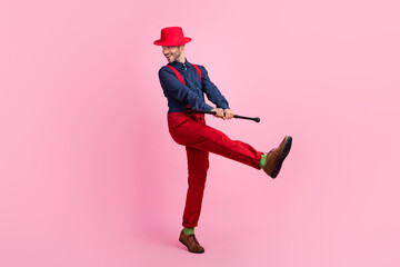 Poster - Full length portrait of crazy overjoyed person arms hold cane stick dancing isolated on pink color background