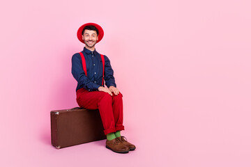 Sticker - Full size photo of young handsome attractive nice student guy sitting bag positive cheerful empty space ad isolated on pink color background