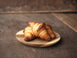 © Chaechaebyv - Golden brown baked homemade French butter croissants on wooden plate