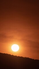 Poster - Timelapse of dramatic sunrise with orange sky in a sunny day.