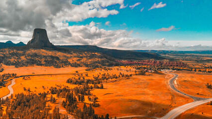 Canvas Print - Aerial view of Devils Tower surrounding countryside in summer season, Wyoming