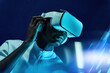 © ADDICTIVE STOCK - Black man touching large screen while exploring virtual reality in modern headset