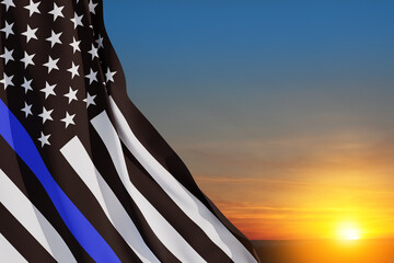 Wall Mural - American flag with police support symbol Thin blue line on sunset sky. American police in society as the force which holds back chaos, allowing order and civilization to thrive. 3d-rendering.