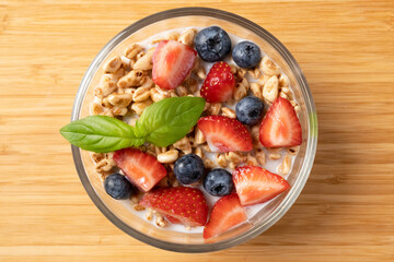 Wall Mural - Granola bowl with fresh fruits and yogurt, healthy eating, healthy breakfast or snack