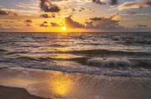 Ocean Waves Washing Beach At Sunrise