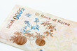 © Tetra Images - Studio shot of Korean Won banknote