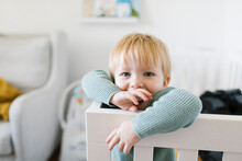 Portrait Of Toddler Boy (2-3) In Crib