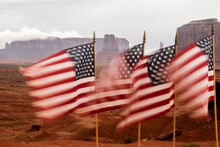 United States, Utah, Monument Valley, American Flags Blowing In Wind