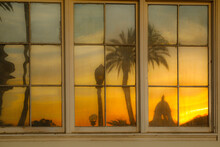 United States, California, Redlands, Sunset Reflecting In Window