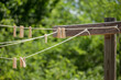 © Tetra Images - Clothes pins on clothes line