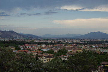 Romantic sunset with landscape in contrast between Vesuvius volcano shadows and blue sky