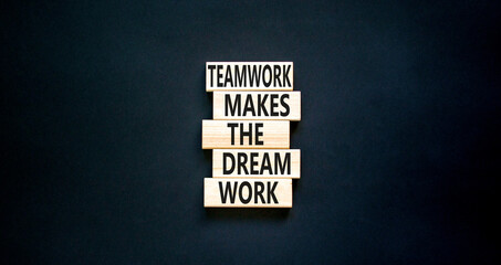Wall Mural - Teamwork makes the dream work symbol. Concept words Teamwork makes the dream work on wooden blocks on a beautiful black table black background. Business Teamwork makes dream work concept. Copy space.