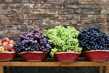 A Display Of Various Grapes At A Small Street Market In Siena, Italy.