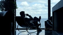 Silhouette Man Enjoying Vacation Life Cognac In Sea View. Businessman Relaxing