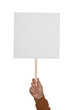 © New Africa - Man holding blank protest sign on white background, closeup