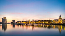 Old Harbor Of La Rochelle, The French City And Seaport. Beautiful Blue Hour Sky. Long Exposure Shot