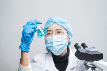 Wall Mural - blue chemical liquid experiment in scientific glassware equipment in science medicine laboratory, ch