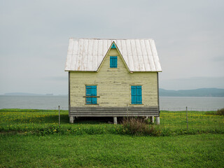 Wall Mural - An old house with view of the sea in Gaspé, Gaspé, Quebec, Canada