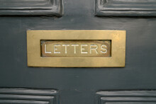 Closeup Entrance Door Brass Mail Slot Letters