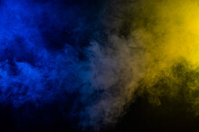 Yellow-blue Smoke In Neon Light On Black Background.
