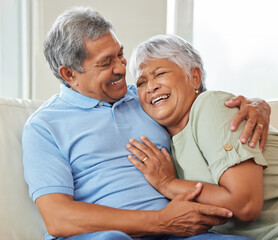 Canvas Print - Love, care and happy senior couple hugging each other while bonding and relaxing on sofa at home. Elderly man and woman sitting on a couch in the living room while embracing, talking and laughing.