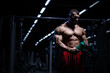 © Fotokvadrat - Muscular man bodybuilder training in gym and posing. Fit muscle guy drinks after workout with weights and barbell