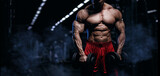 Muscular man bodybuilder training in gym and posing. Fit muscle guy workout with weights and barbell