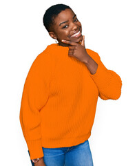 Sticker - Young african american woman wearing casual clothes looking confident at the camera smiling with crossed arms and hand raised on chin. thinking positive.