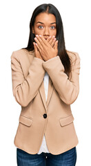 Poster - Beautiful hispanic woman wearing business jacket shocked covering mouth with hands for mistake. secret concept.