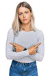 © Krakenimages.com - Beautiful blonde woman wearing casual clothes pointing to both sides with fingers, different direction disagree