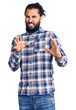 © Krakenimages.com - Young arab man wearing casual clothes disgusted expression, displeased and fearful doing disgust face because aversion reaction. with hands raised