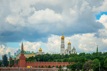 Kremlin Embankment On River Moscow. On Background Grand Kremlin Palace, Church Of The Kremlin.
