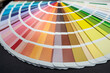 many different color palettes sepmler rainbow fan spread out on the table.
