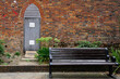 bench and ancient door in a park garden