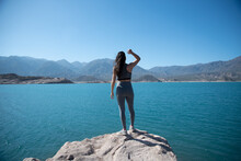 Beautiful, Relaxed, Young Woman At A Mountain Lake