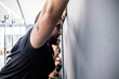 © Eugenio Marongiu - Young athletic sportive man indoors gym training stretching